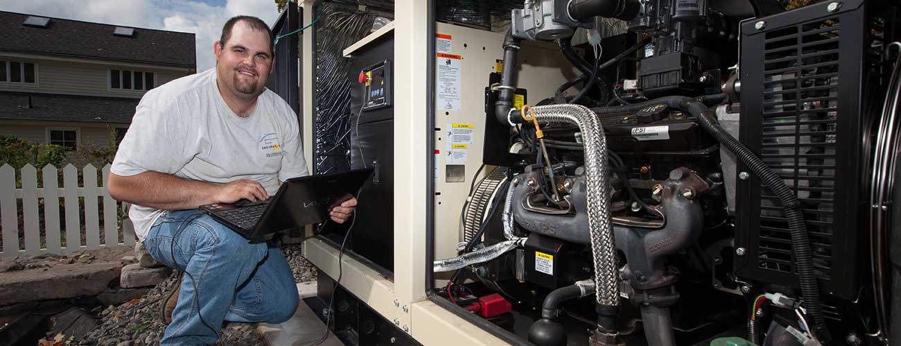 Gen Plus technician servicing a generator